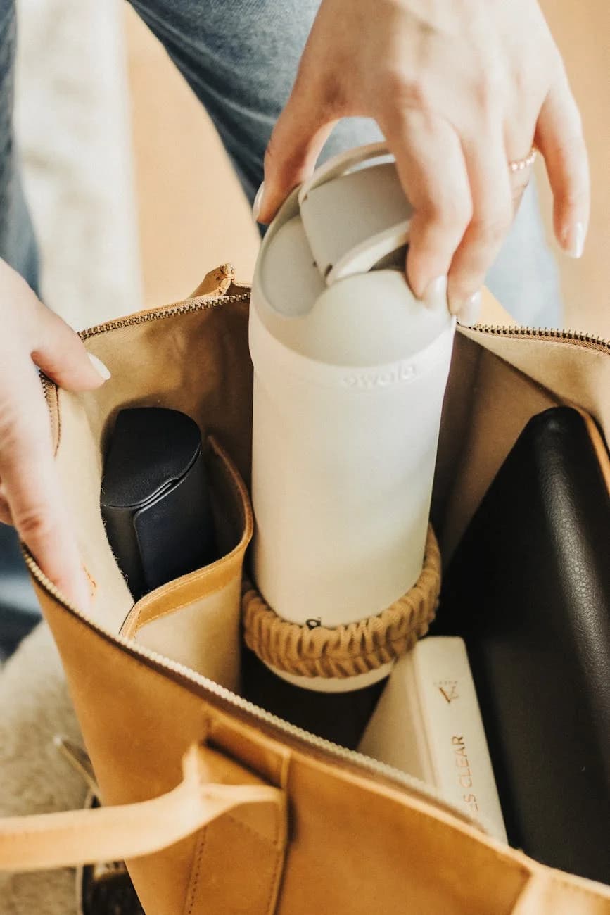 A Leather Tote Bag Neatly Packed With Tr 1