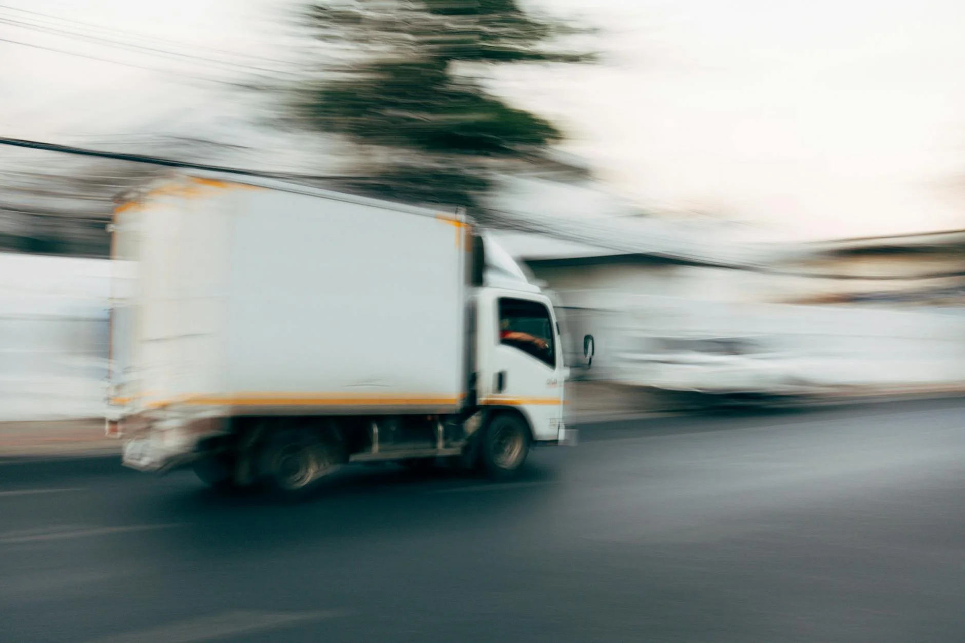 Blurred Image Of A Truck Speeding On A C 1