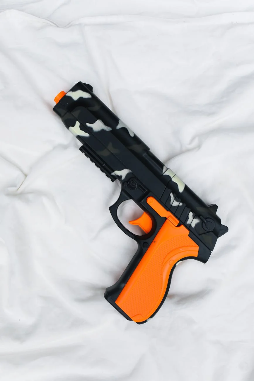 Camouflage And Orange Toy Gun On White F 2