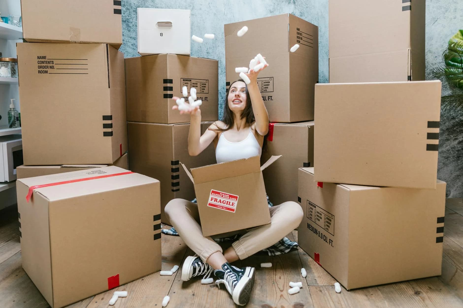Young Woman Surrounded By Cardboard Boxe 5