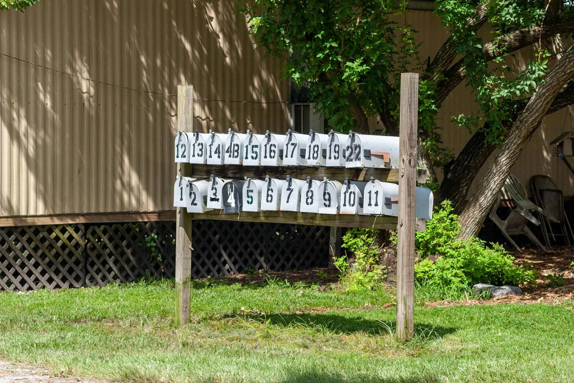 Multiple Mailboxes In A Row Beside A Hou 2