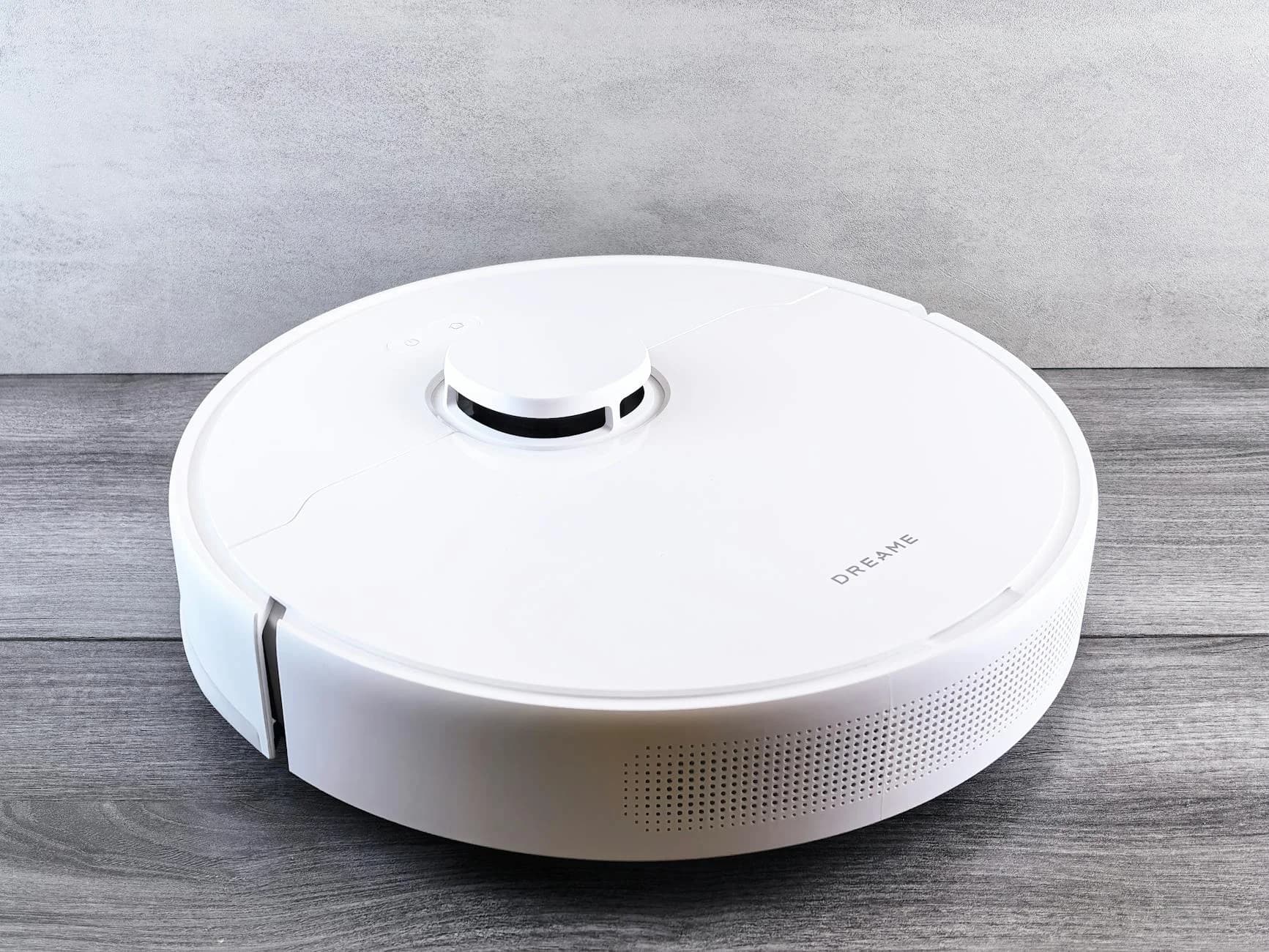 Sleek White Robot Vacuum Cleaner On A Wo 3