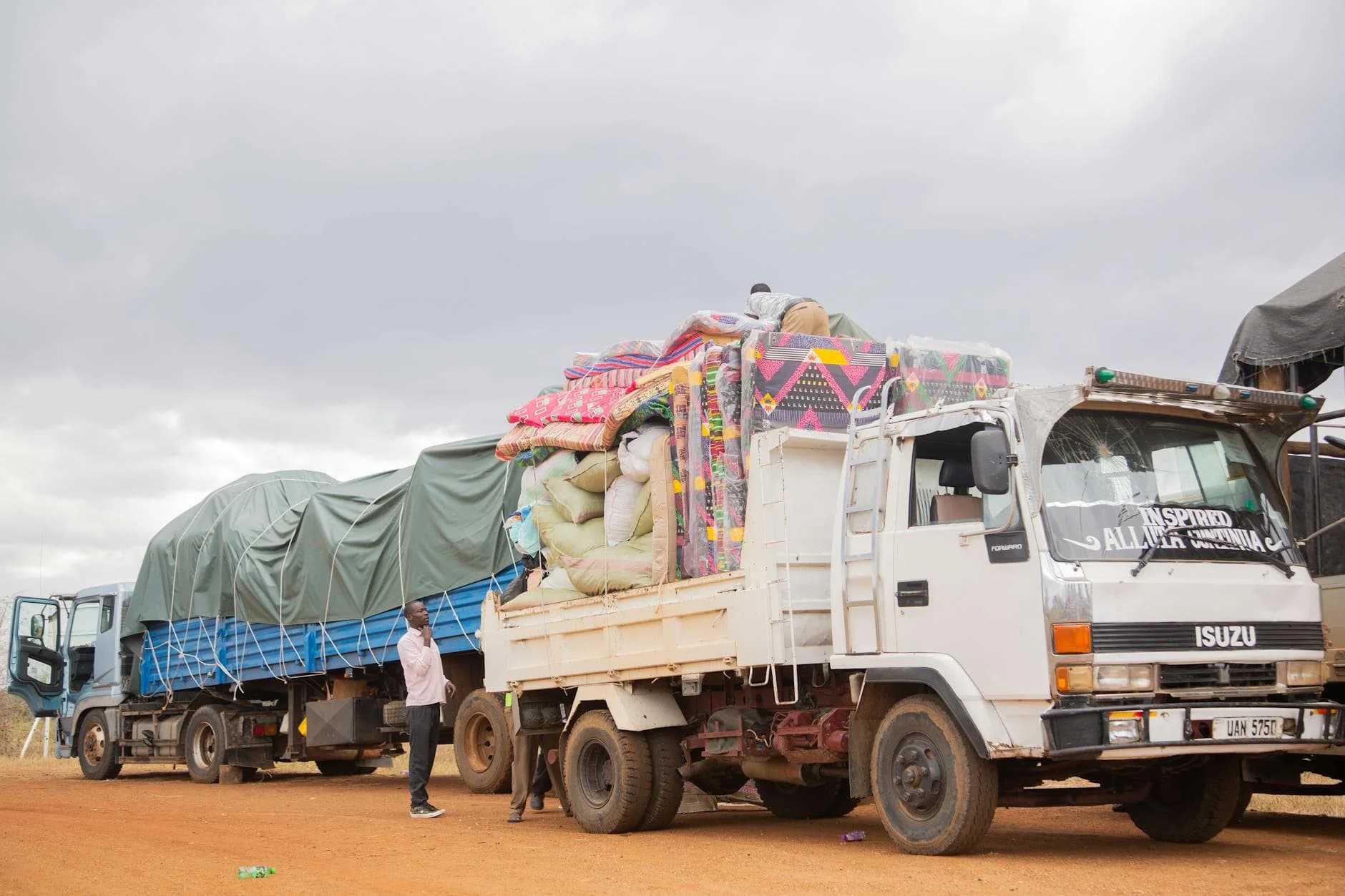 Trucks Loaded With Goods Parked On A Dir 1
