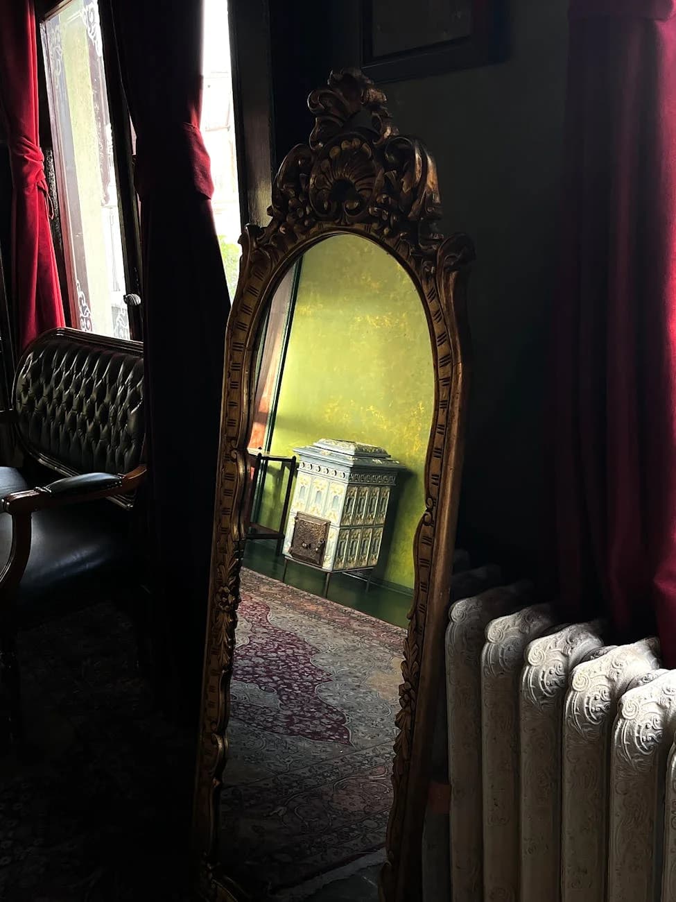 A Vintage Ornate Mirror Reflecting A Dol 4