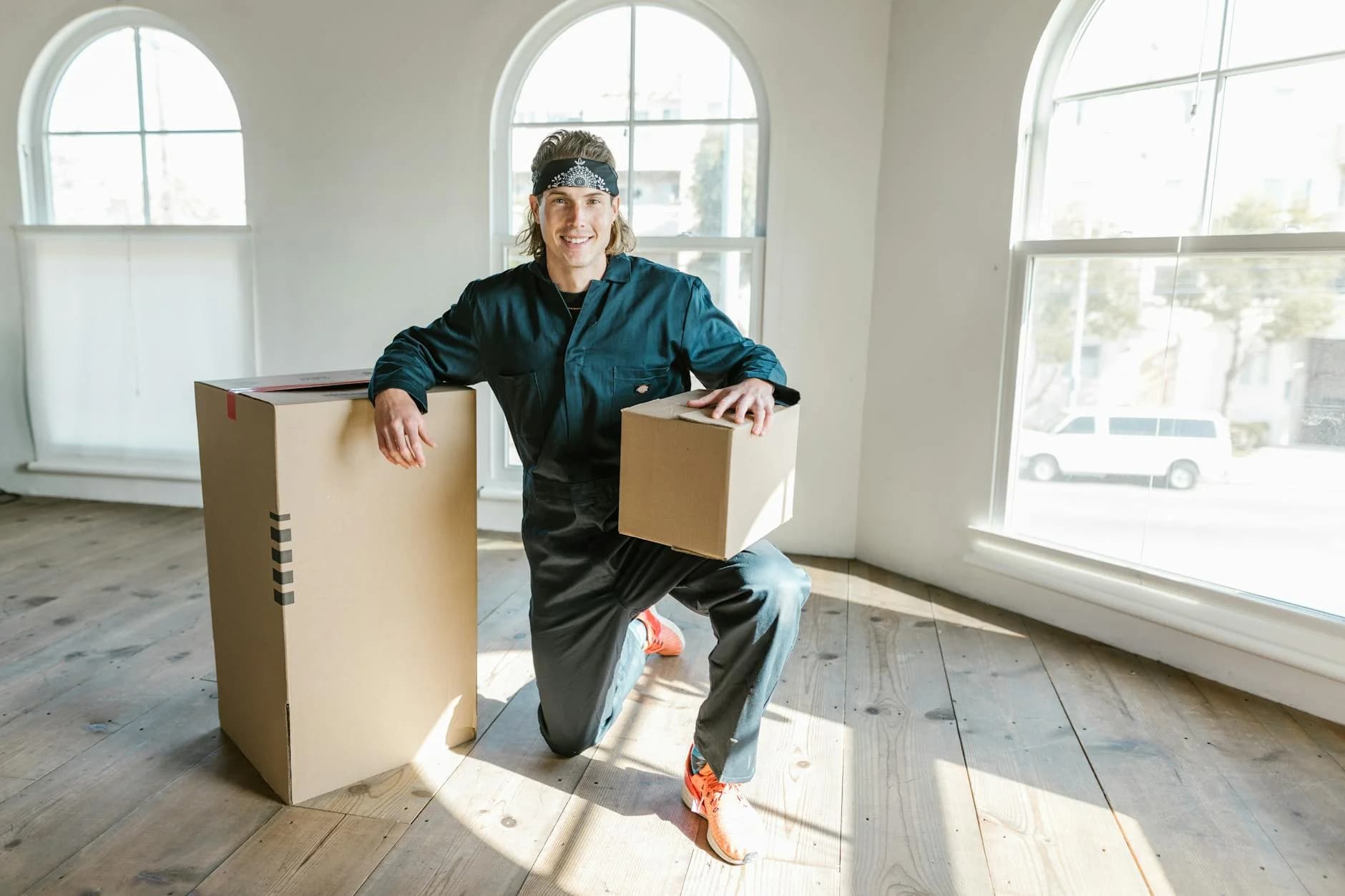 A Mover In A Coverall Preparing Boxes Fo 1