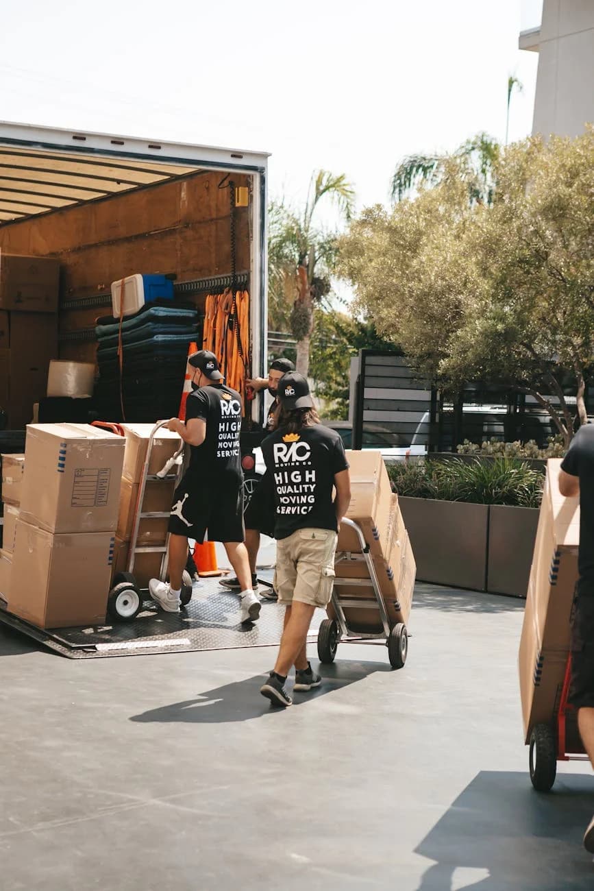 Svc Movers Loading Boxes Into A Truck On A S 2