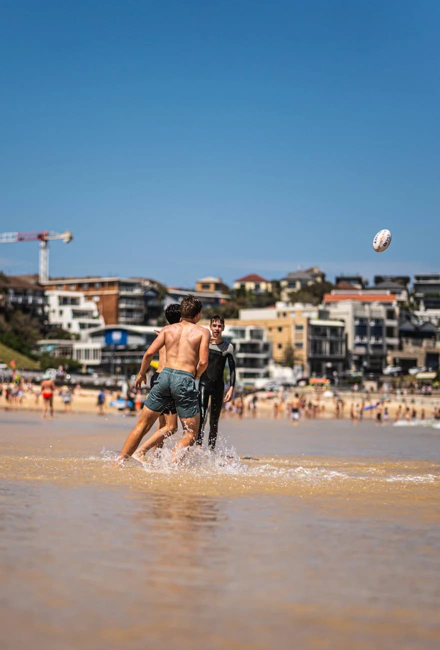 Two Men Playing Beach Rugby In Sydney On 3
