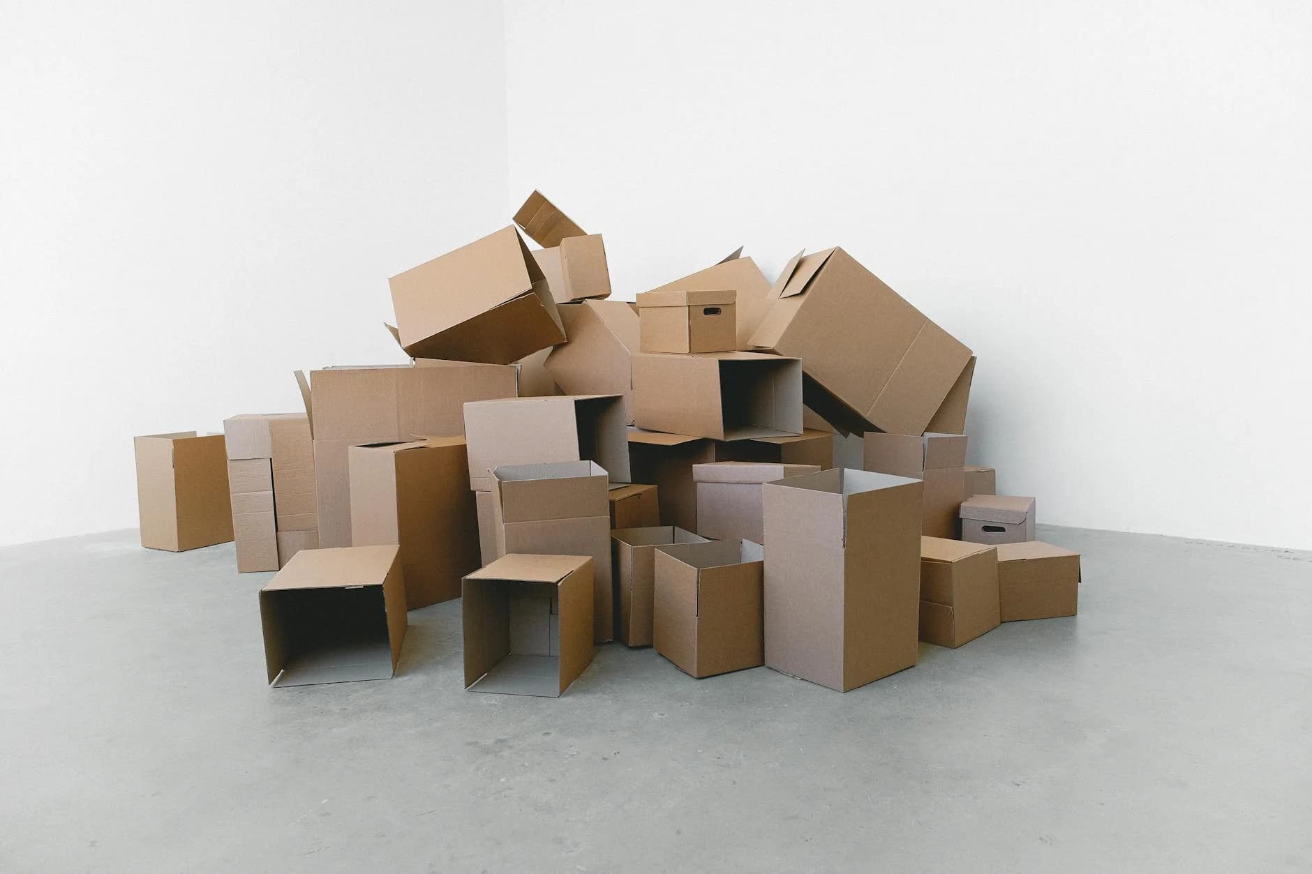 A Pile Of Empty Cardboard Boxes Arranged 3