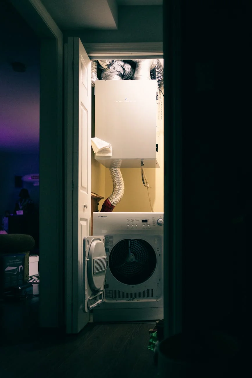 A Cozy Laundry Closet With A Dryer And V 4