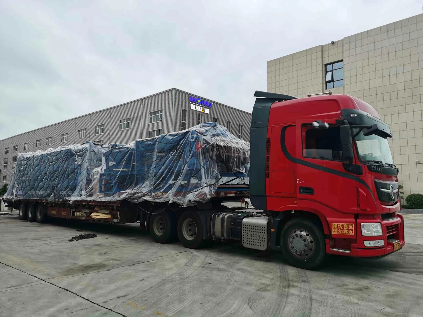 Red Truck With Large Covered Cargo In An 4