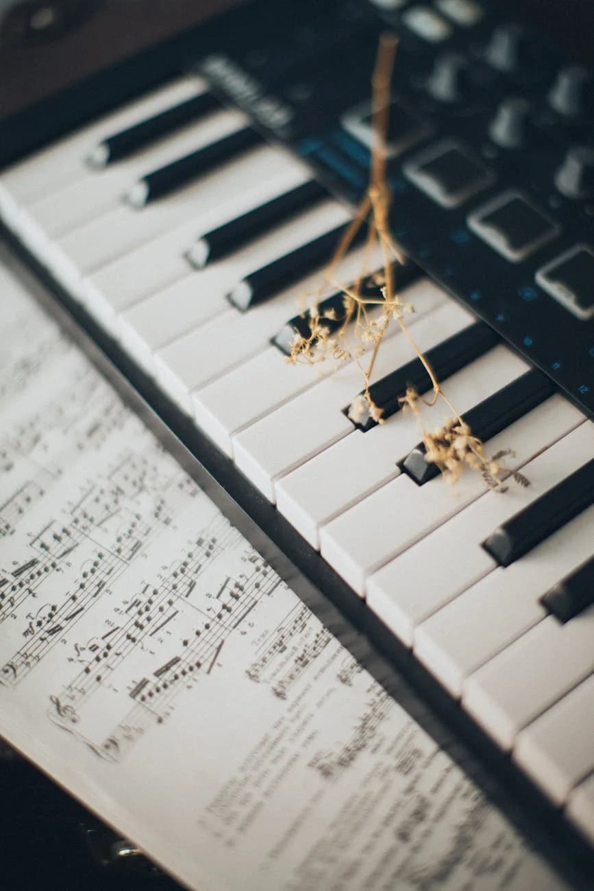 Close Up Of Piano Keys With A Flower And 3