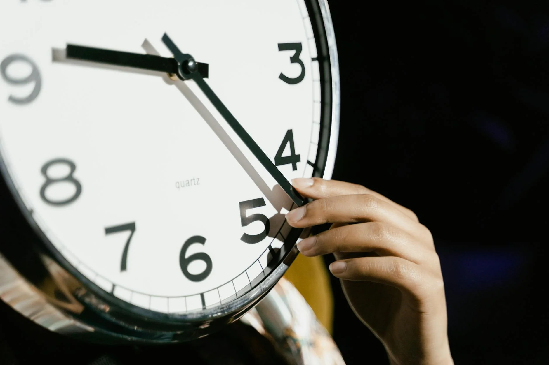 A Hand Adjusting The Time On A Large Ana 3