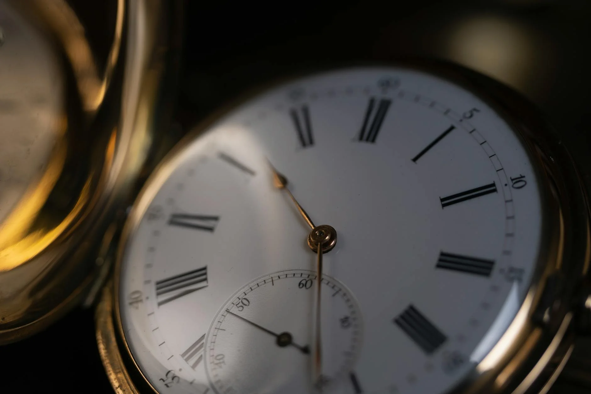 An Antique Pocket Watch Displaying Roman 5