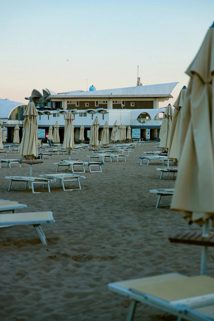 Empty Sandy Beach With Lounge Chairs And 2