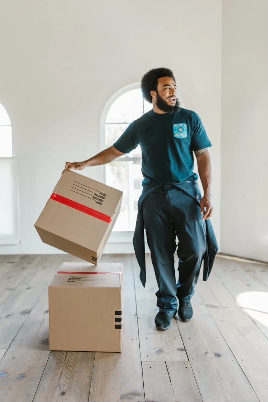 A Mover Carefully Handles Boxes In A Bri 4