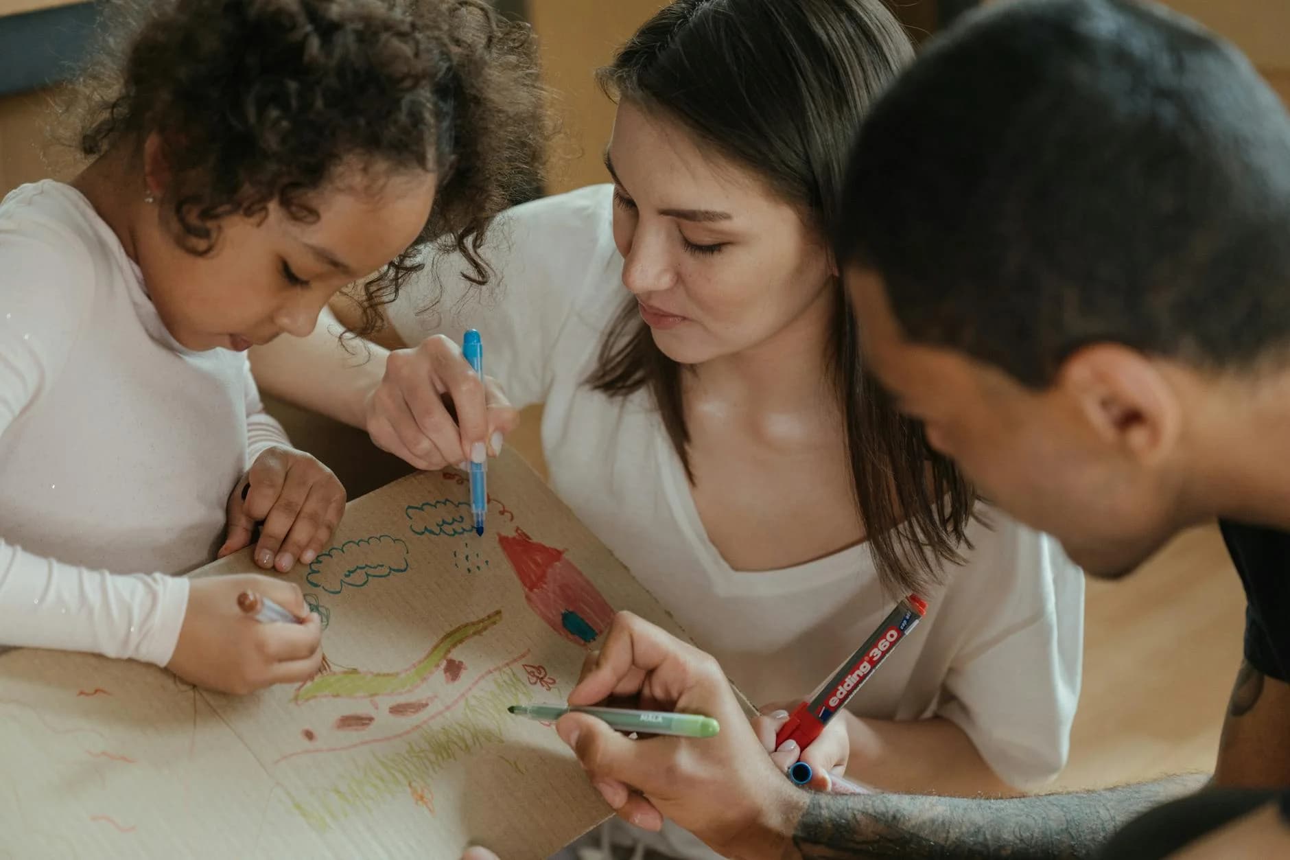 A Family Drawing Together On Cardboard E 4