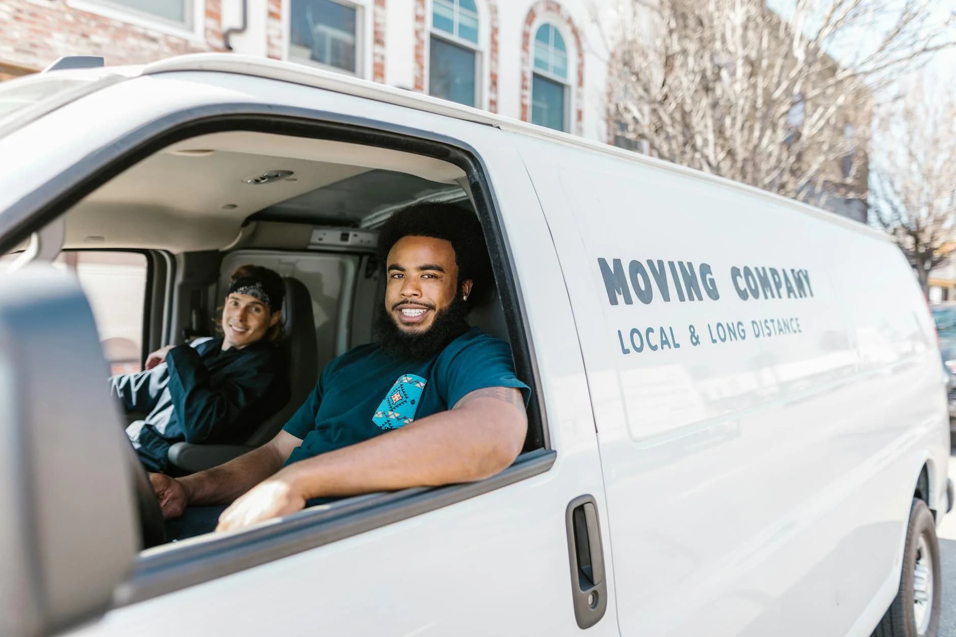 Two Movers Smiling From Their Moving Com 5