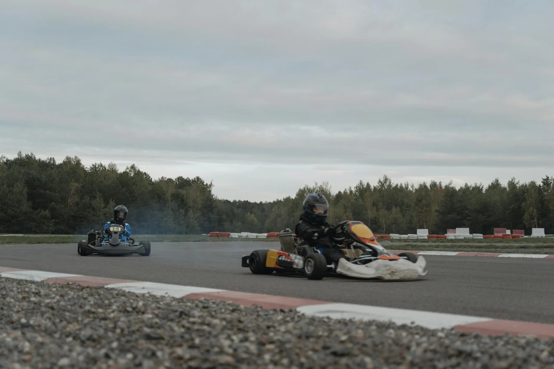 Two Racers Competing In A Thrilling Outd 3