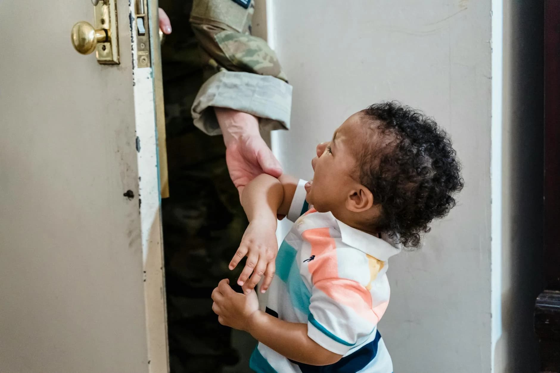 A Young Child Crying As A Soldier Parent 3